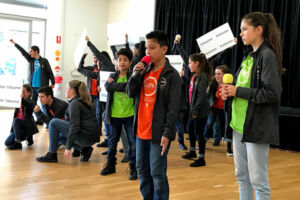 students singing on stage