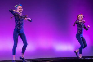 students dancing on stage